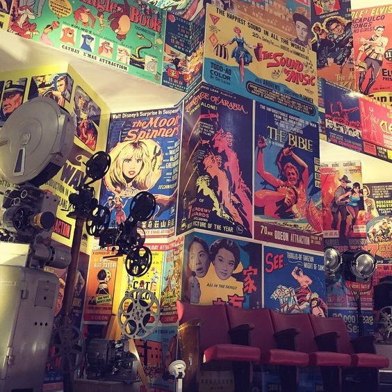 The gallery walls are lined with technicolour vintage movie posters