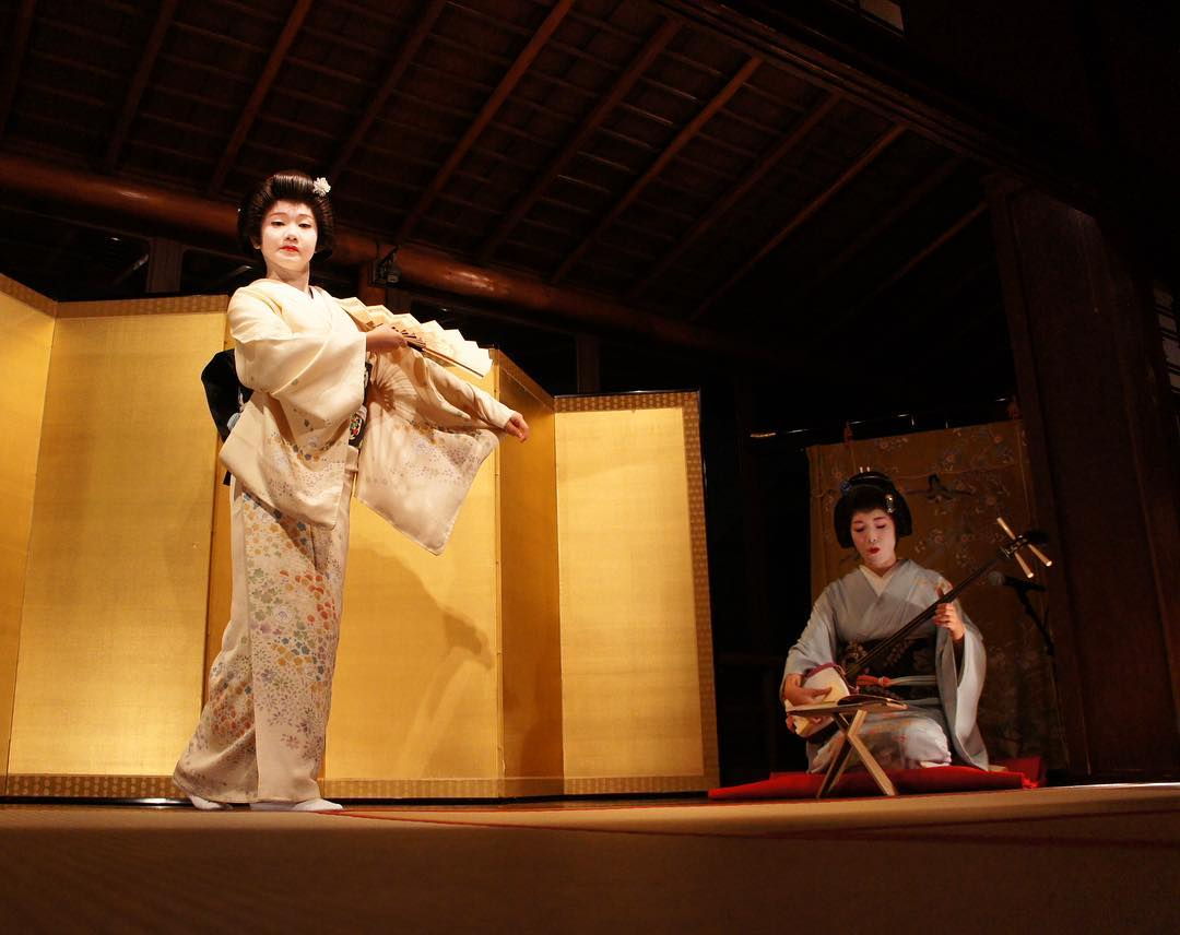 Geisha performance in teahouse.