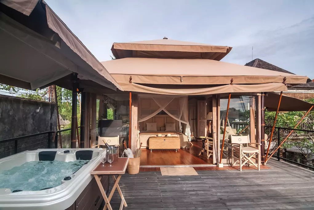 private jacuzzi in a glamping tent at kuta utara