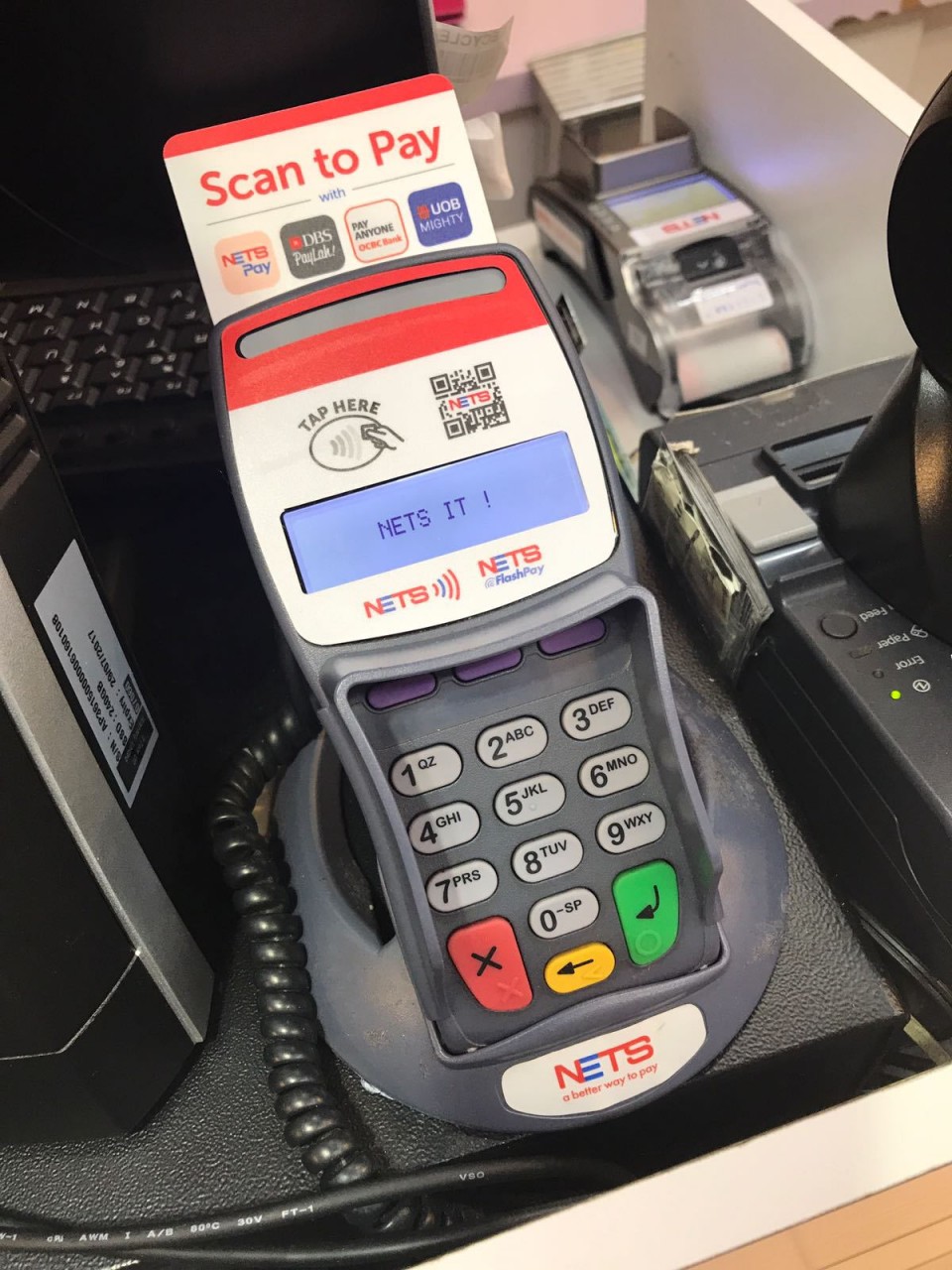 Just look out for the “Scan to Pay” NETSPay merchant sign above!