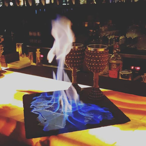 kuvo elixir bar alchemy cocktail fire