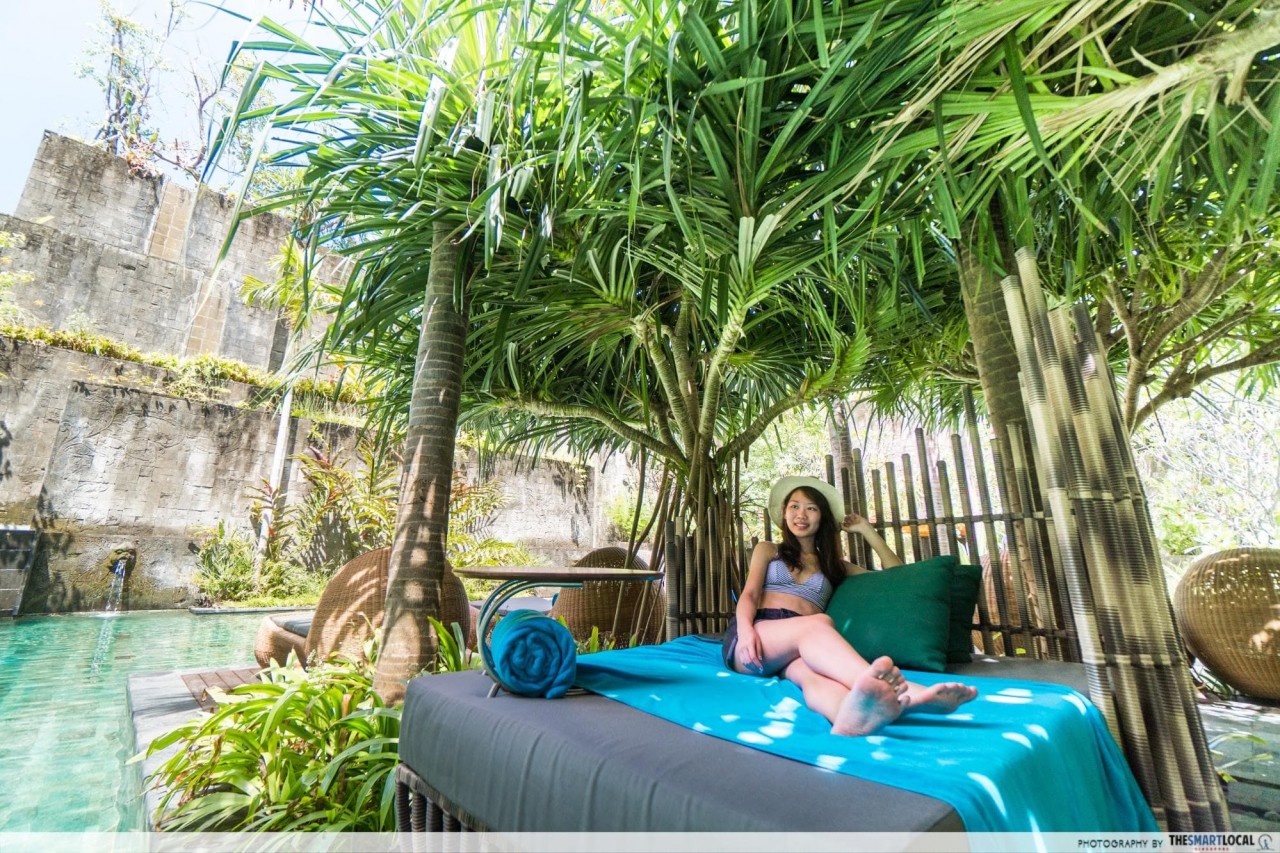 hotel indigo bali - bed beside secret garden pool
