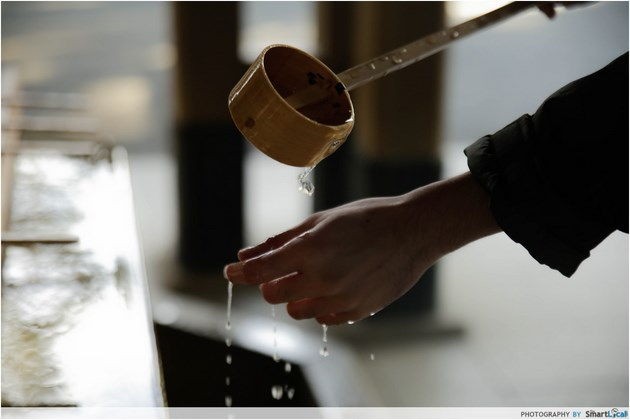 Washing hands before entering shrine Tokyo