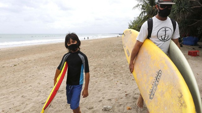 Bali beaches reopen - Surfers in Kuta