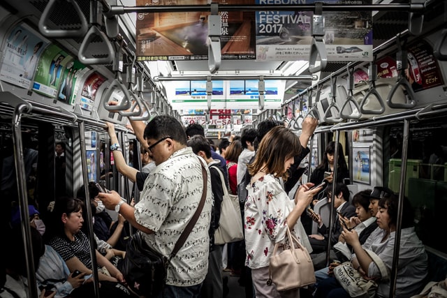Mysteries in Japan - passengers using phones on train