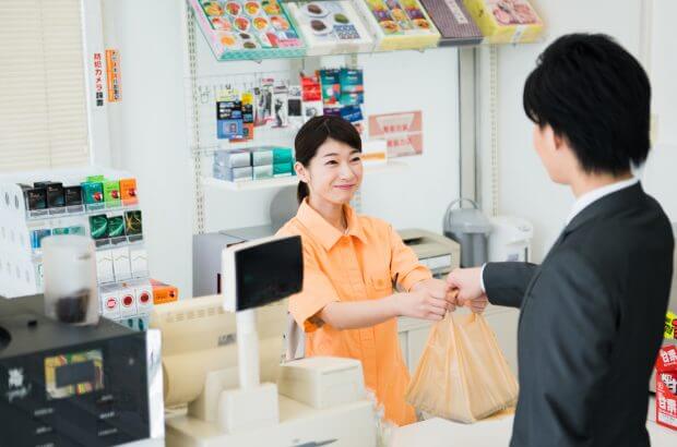 Konbini - counter staff and customer
