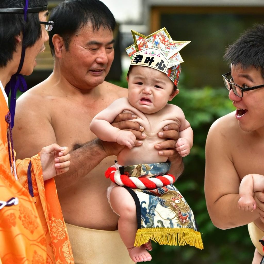 Naki Sumo Baby Crying Contest - sumo wrestlers and shinto priest make a baby cry