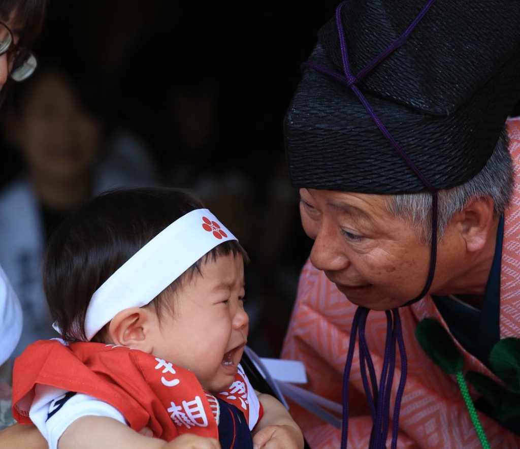 Naki Sumo Baby Crying Contest - shinto priest makes a baby cry 