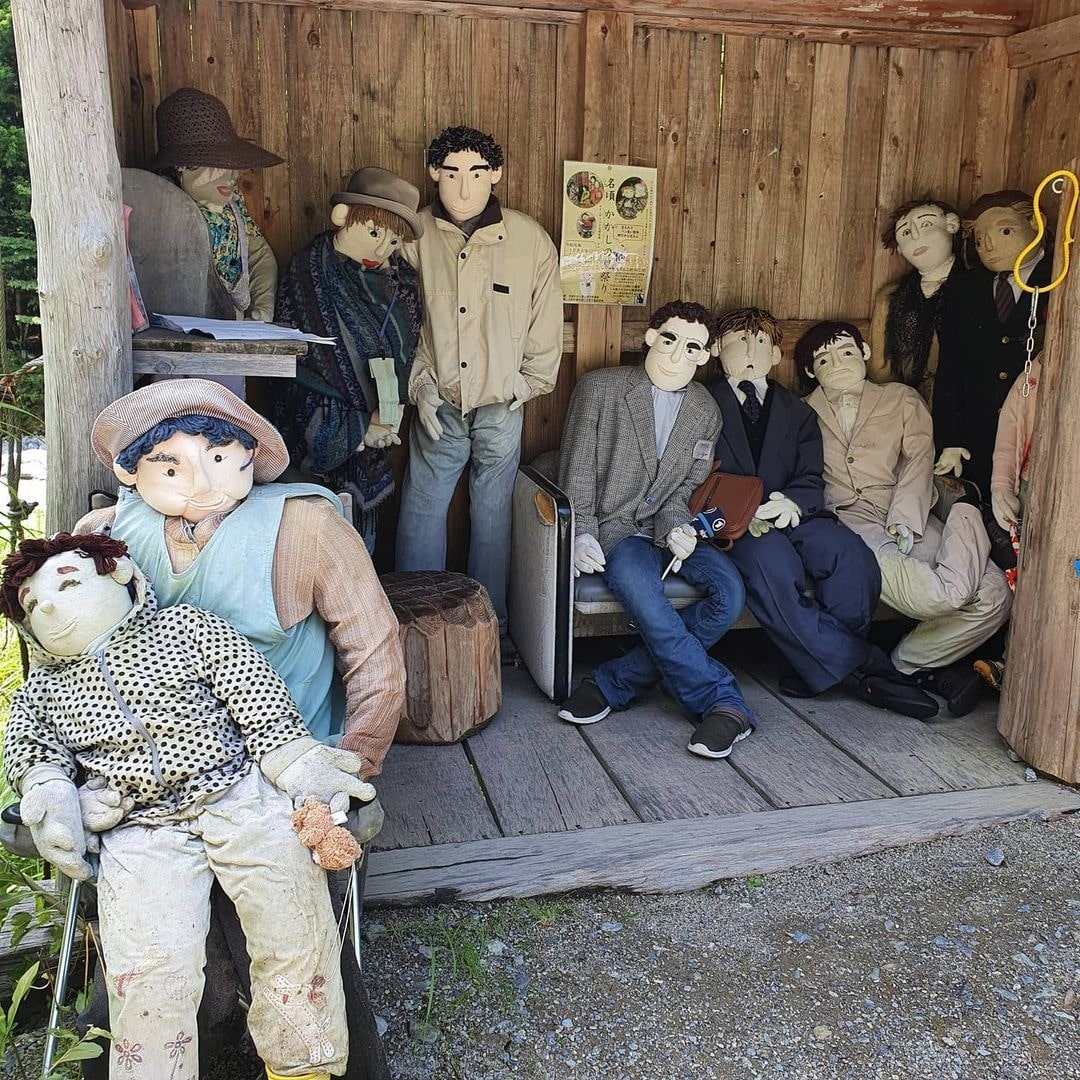Japanese Scarecrow Village - villagers sitting together