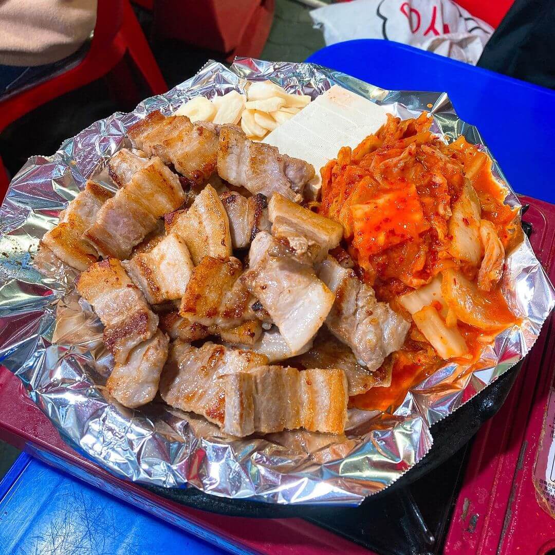 Pocha streets in seoul - grilled pork belly with kimchi