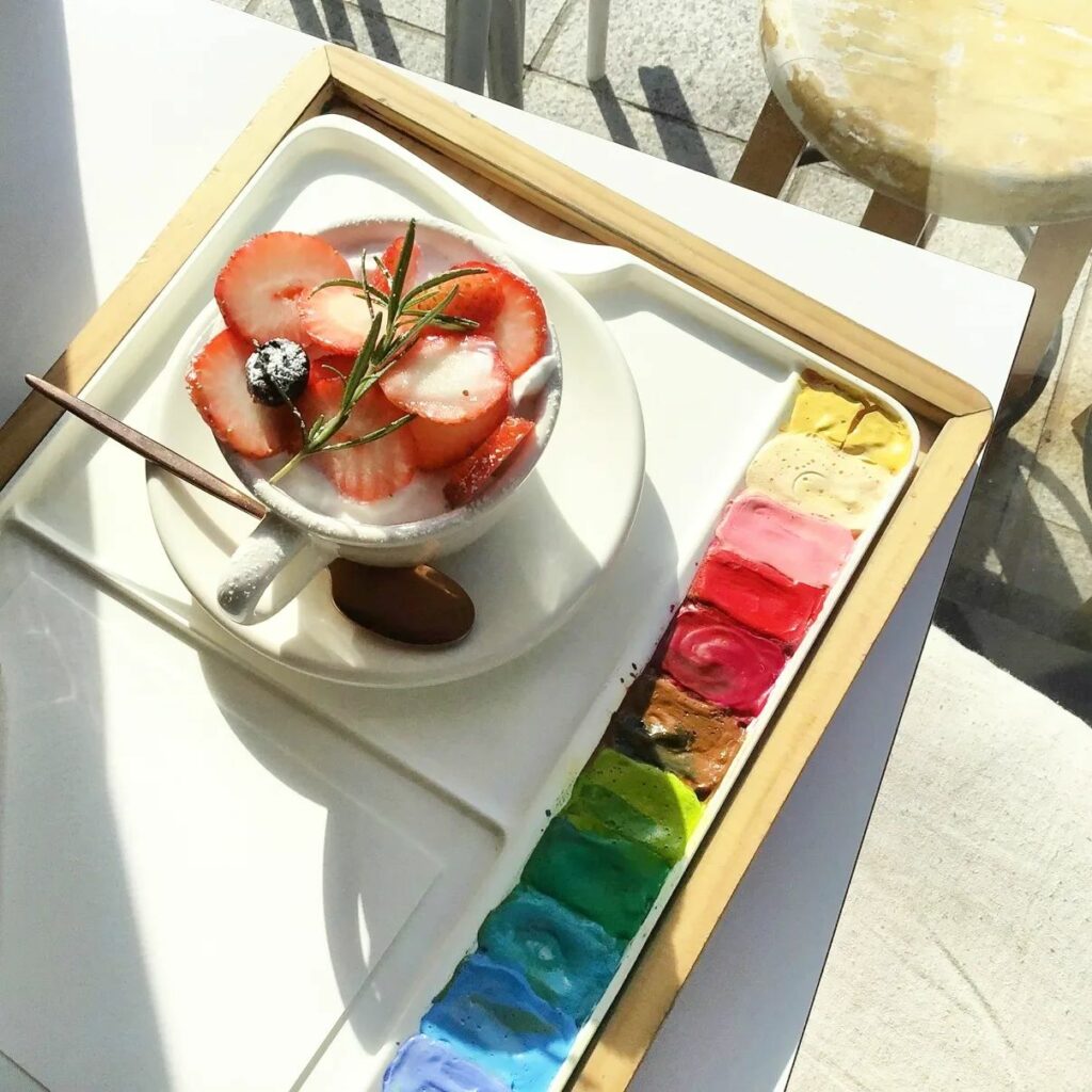 dessert on a tray shaped like a watercolour palette
