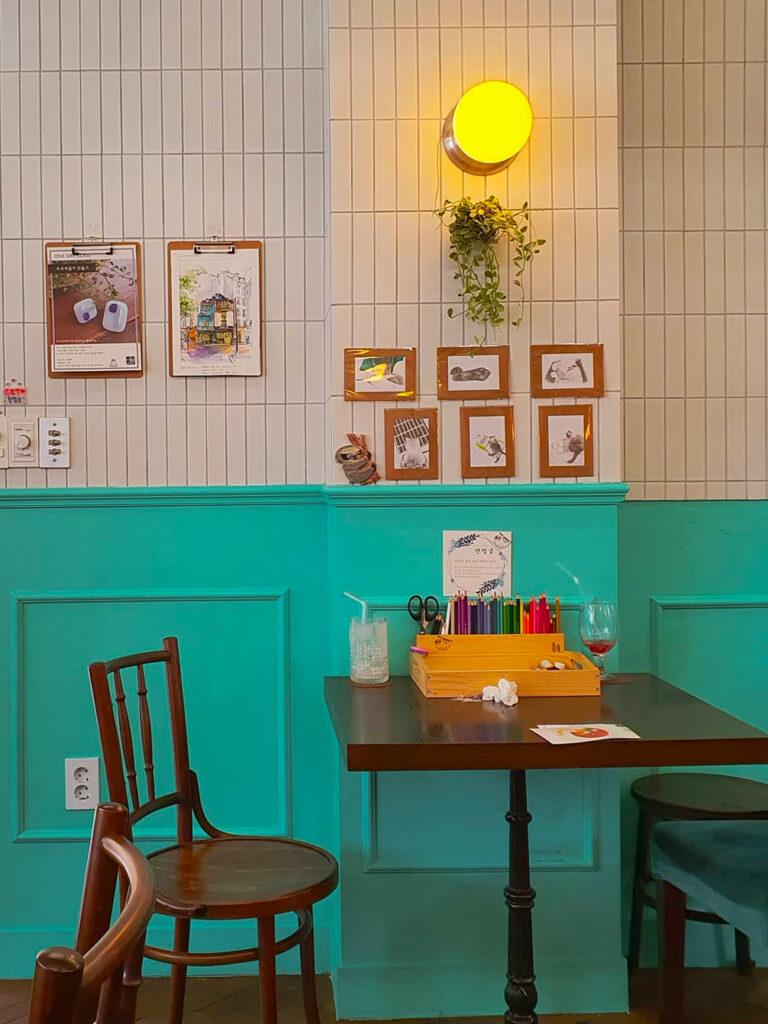 white and teal interior of cafe