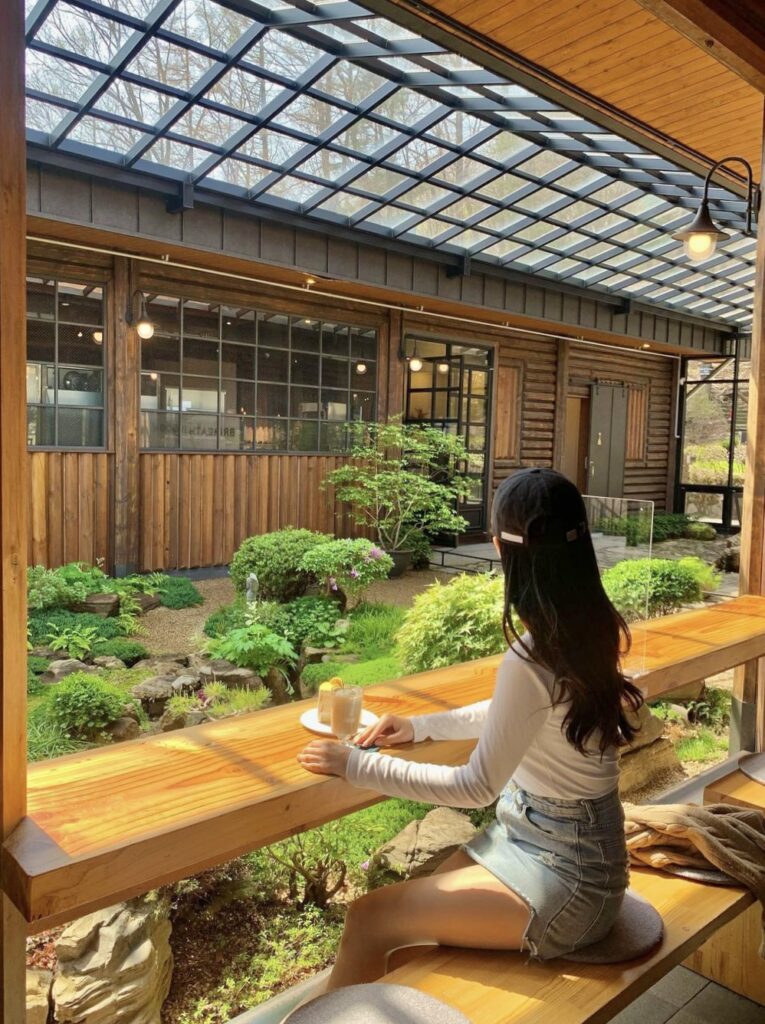 Cafe Soom - girl facing indoor garden