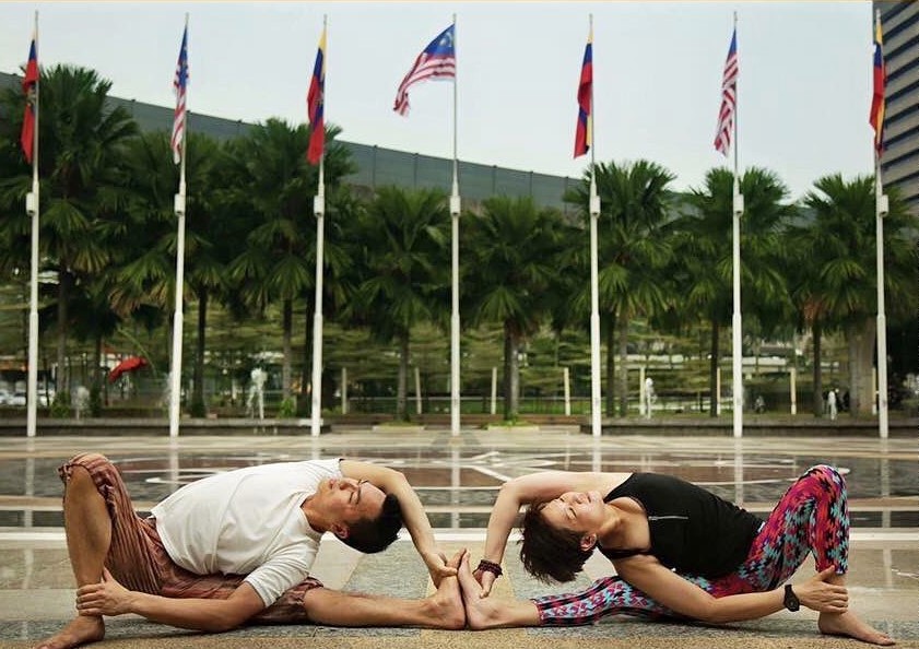 instructors doing a yoga pose