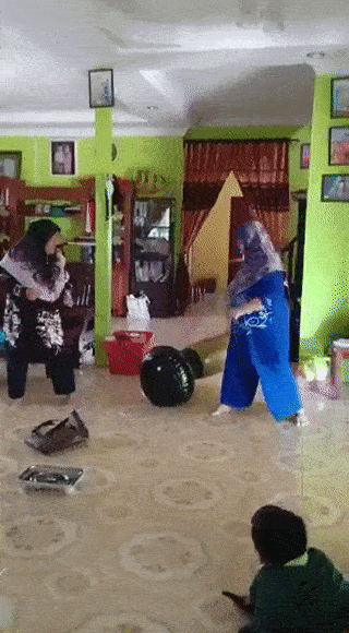 grandmothers play with punching bag (2)