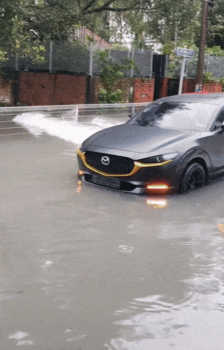 Myvi drives through the flood