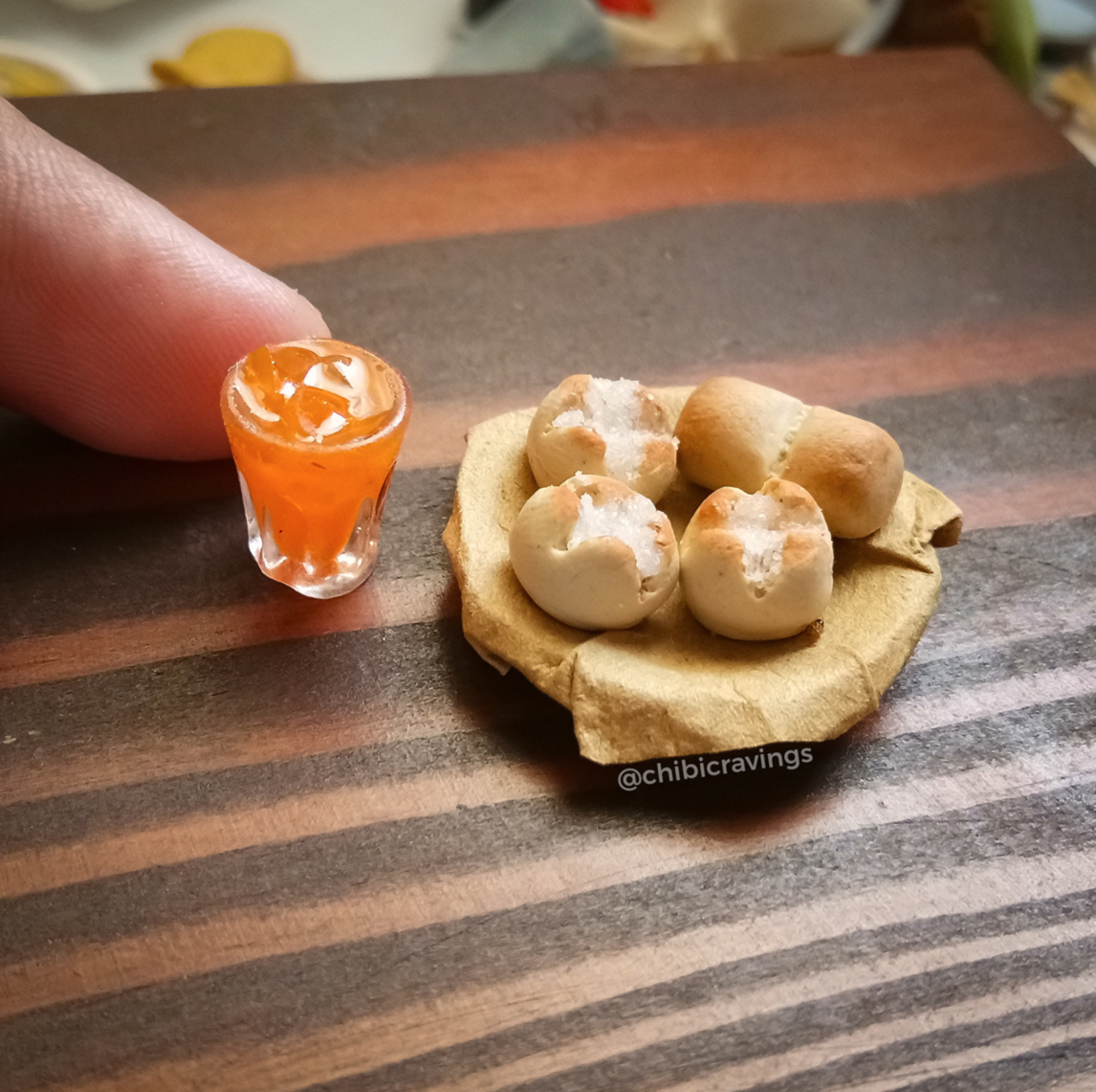 miniature pieces of bread and glass of orange juice