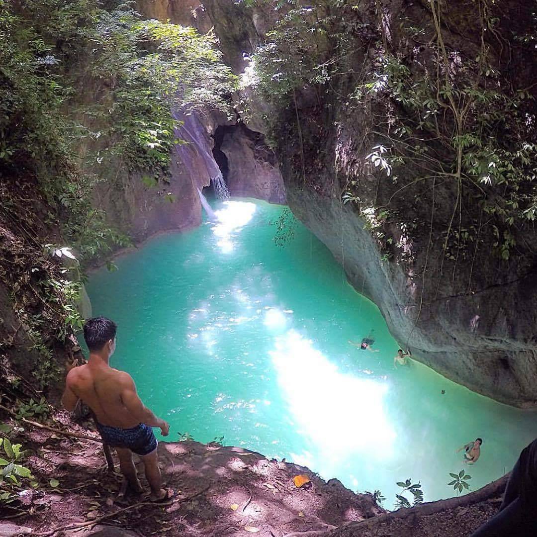 Kabutongan Waterfalls, Cebu - Person preparing to cliff dive