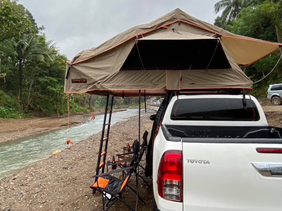Balai Tanay - a vehicle fitted with a tent at a camping spot