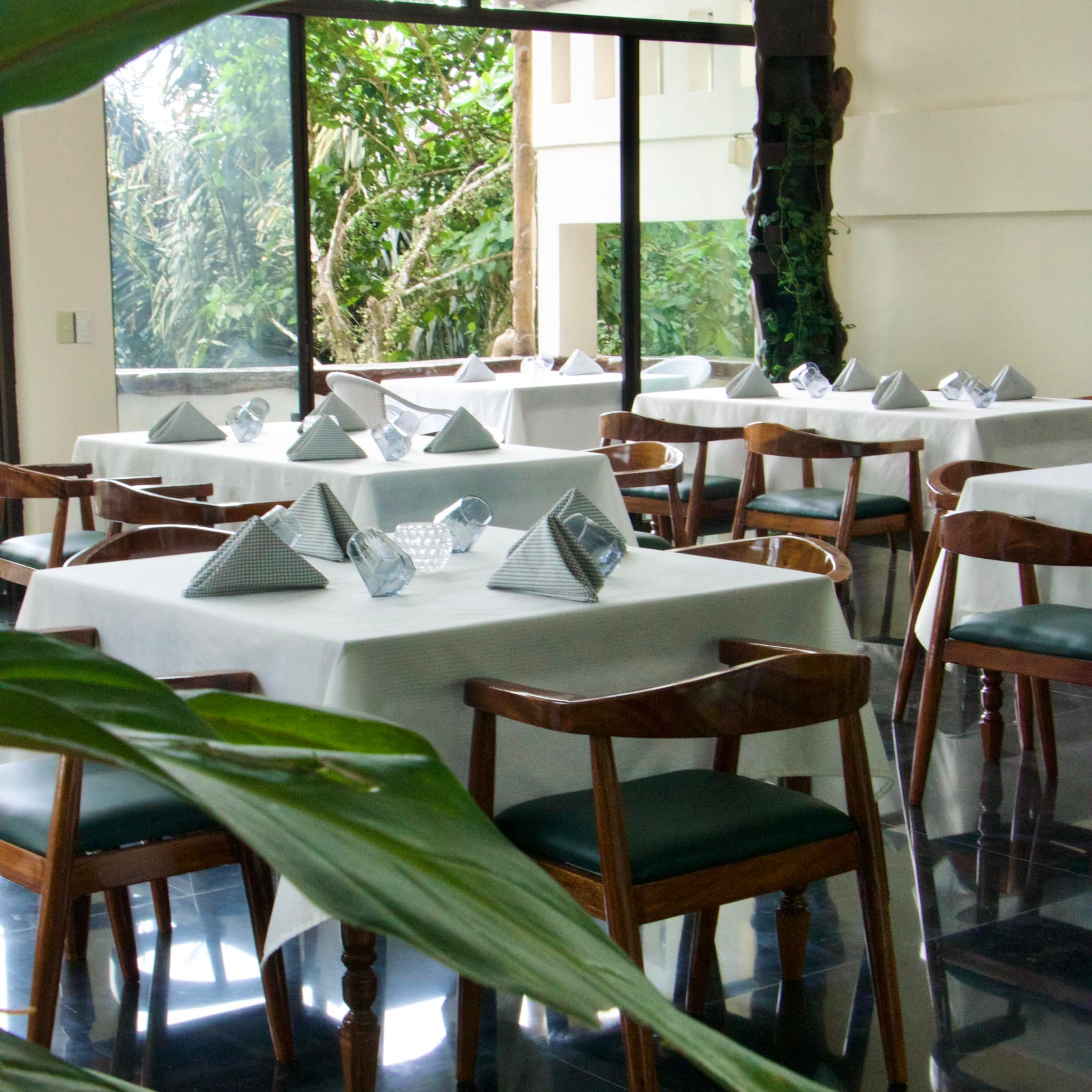 Prism Restaurant Cafe in Batangas - elegant wood and greenery interior