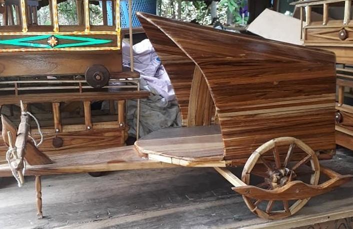 thai uncle make retro wooden cartwheels toy