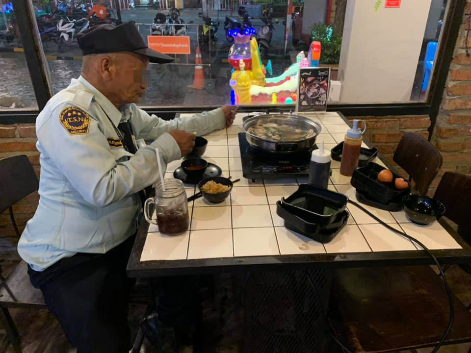Woman Treats Security Guard To Hot Pot Meal After Catching Him Watching Her Eat From Outside