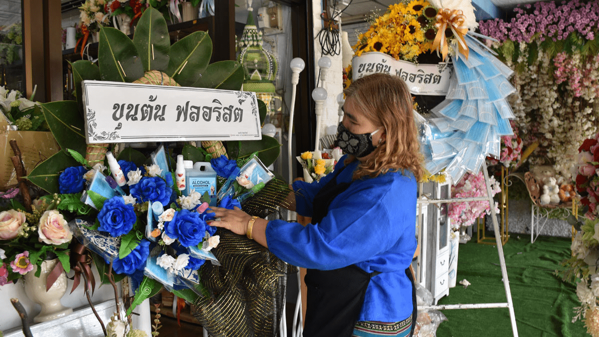 face mask and hand sanitiser wreath in Thailand