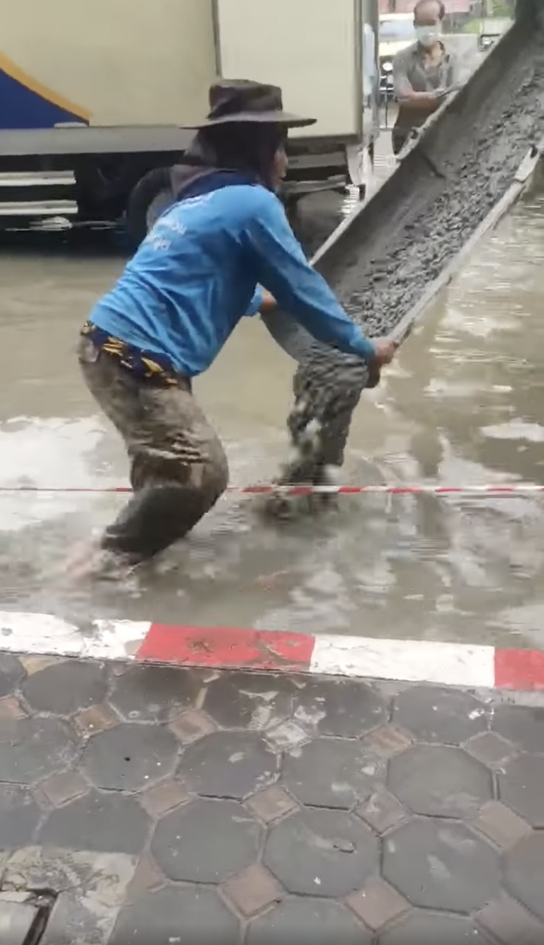 Thai Construction Crew Fixes Road In Heavy Flood, Netizens Question Its Effectiveness