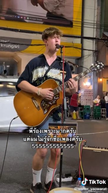 Handsome Foreign Tourist Sings On Yaowarat Road