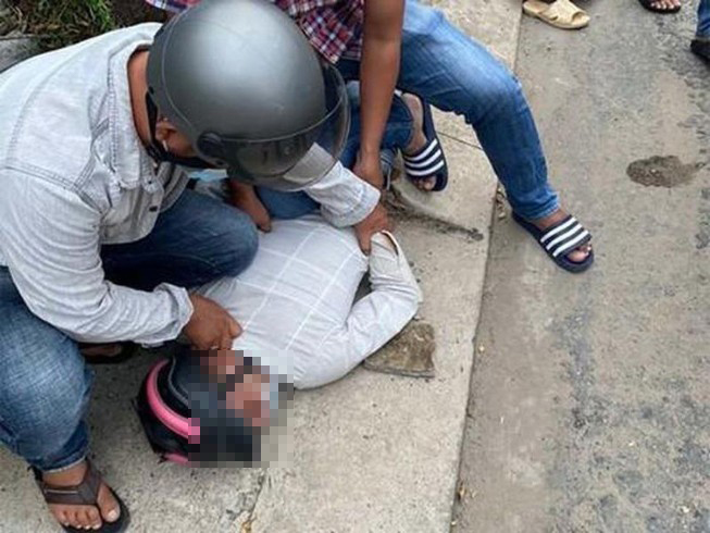 woman saigon robbers - apprehended robber