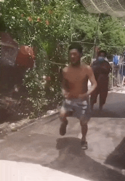 man jumps rope with neighbors