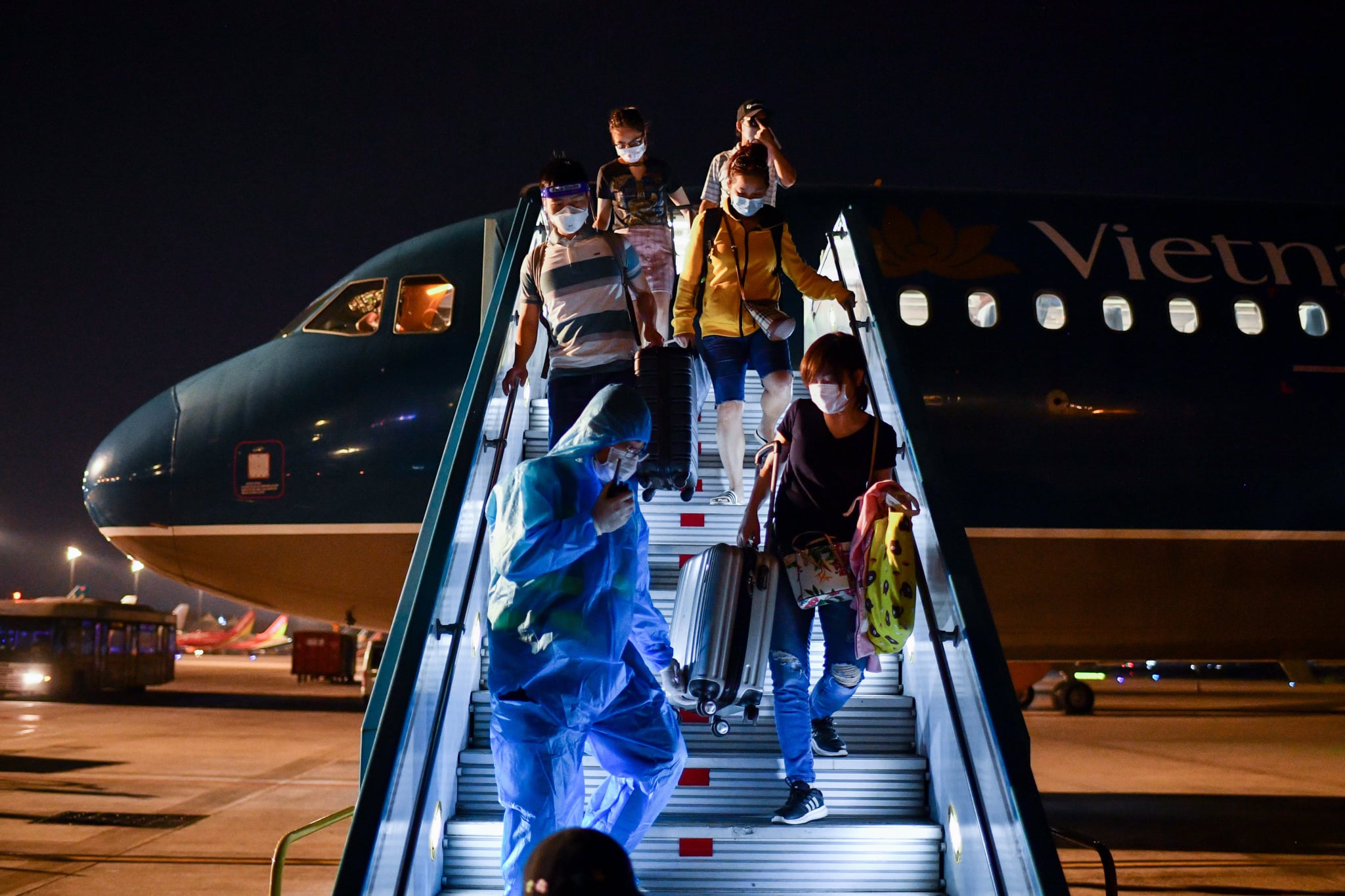 flights to Vietnam - passengers disembarking at airport