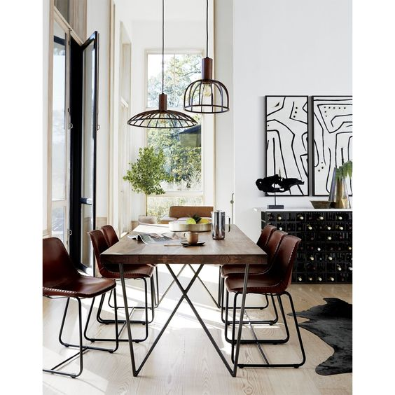 Geometric ceiling lamps over dining table
