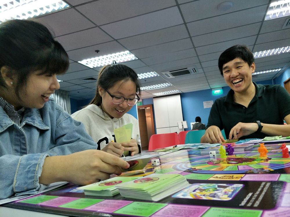 People playing boardgames at workshop
