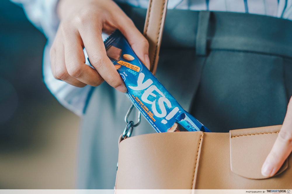 nestle yes bar - keeping snack bar into bag