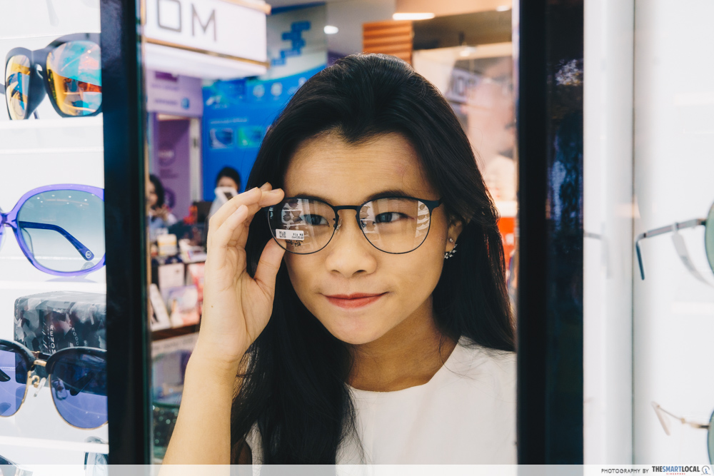 Girl trying on glasses