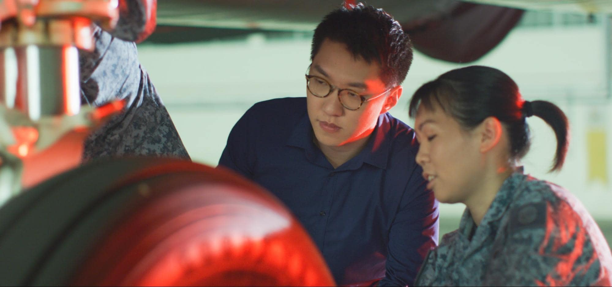 Chen Juncheng (left) from the Defence Science and Technology Agency (DSTA) helps the RSAF manage their aircrafts.