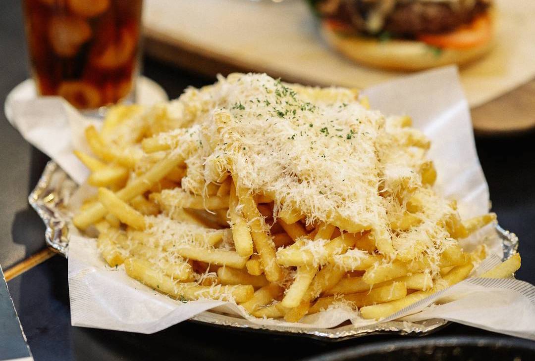 A sprinkle of truffle oil you can get from the supermarket is all it takes to enhance your simple fries.