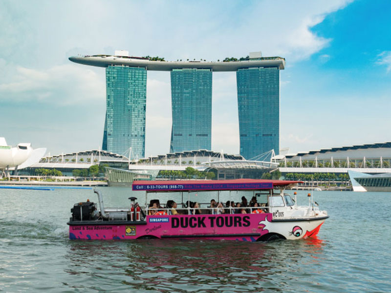 take a ride on the singapore river on a ducktours ride.