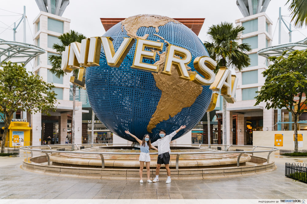 Posing in front of Resorts world sentosa universal globe 