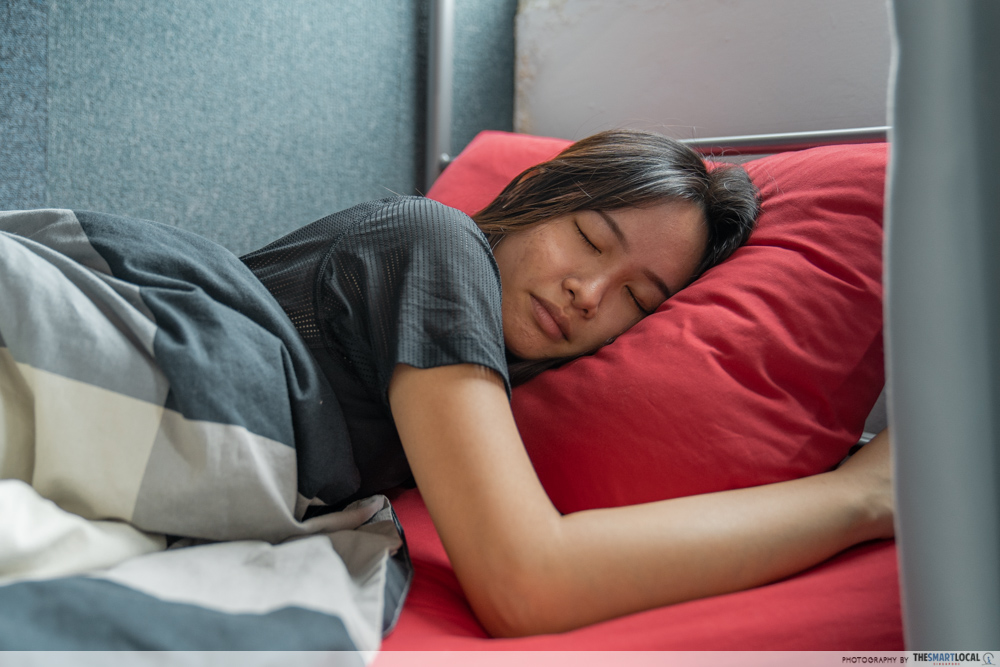 girl lying on pillow to sleep off existing back pains, common back pain mistakes