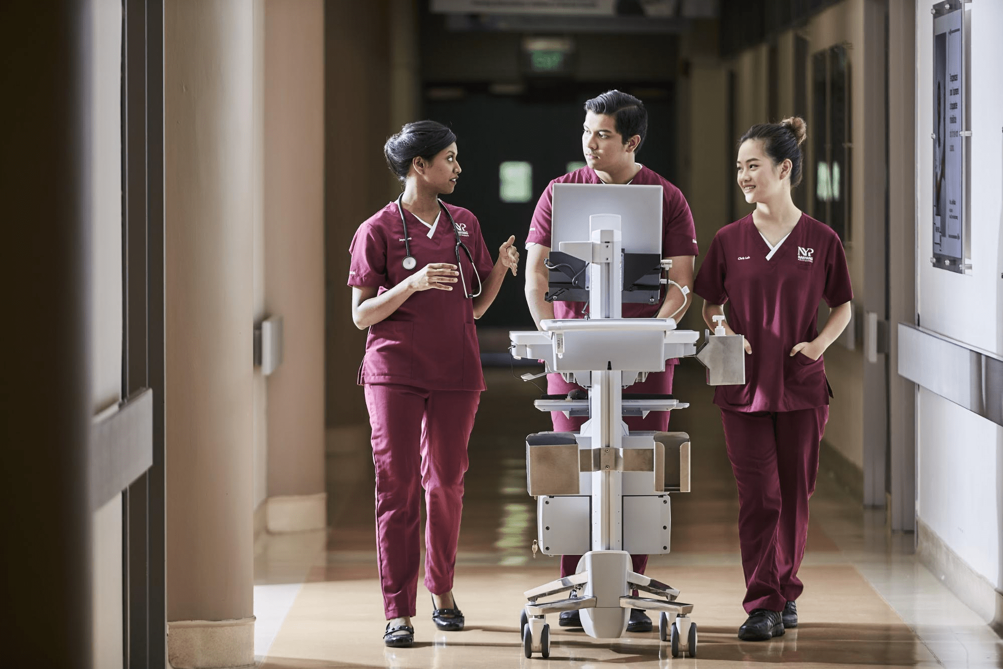 nurses walking in a hallway