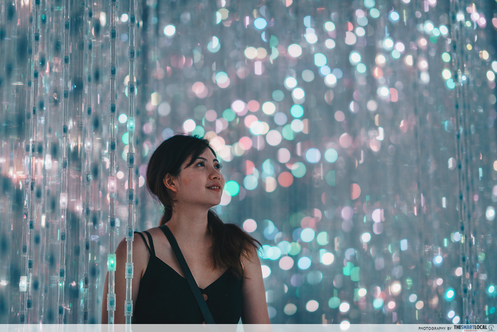 Image of woman looking at lights at the Future World exhibit