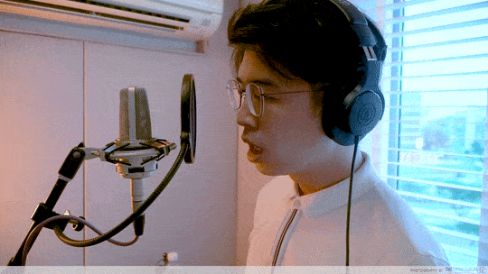man singing in a recording studio