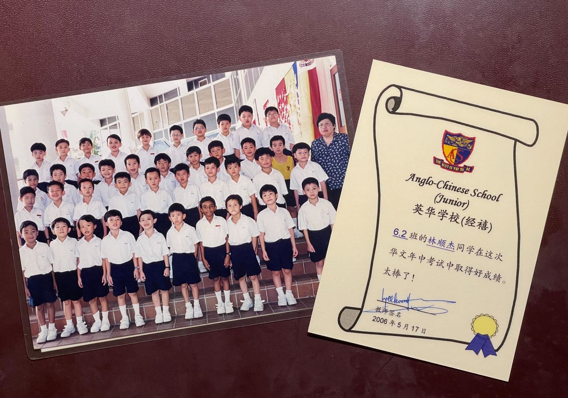singapore chinese heritage - class photo of ian in primary school, along with an award for good Chinese grades