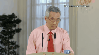 pm lee drinks from magic cup
