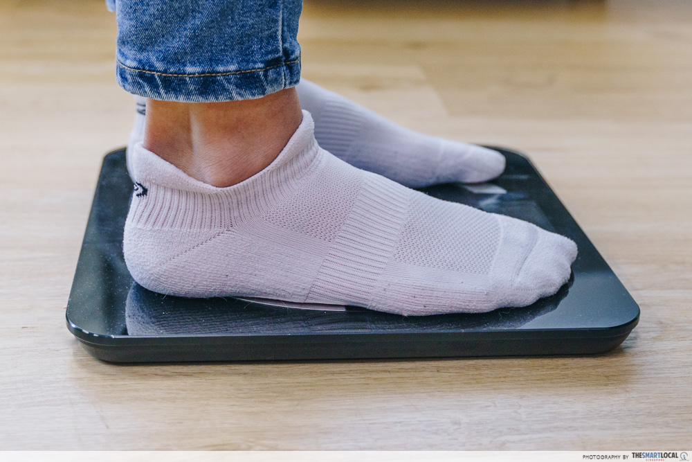 feet of someone standing on weighing scale