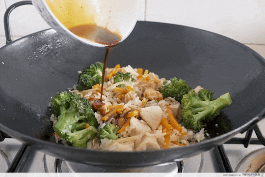 GIF of pouring sauce in fried rice