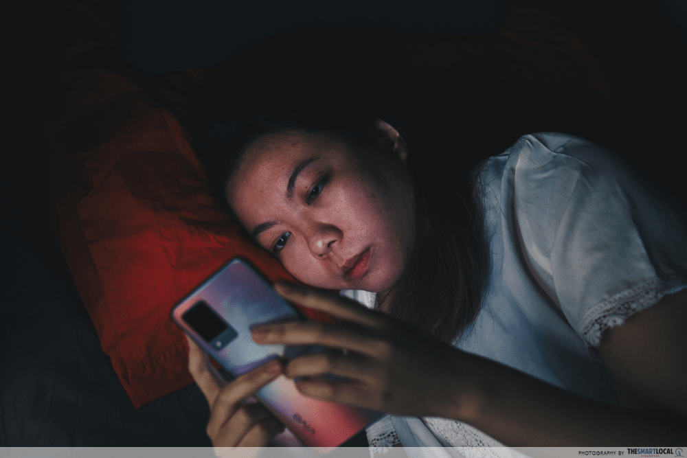 girl looking at phone, in depression due to work stress