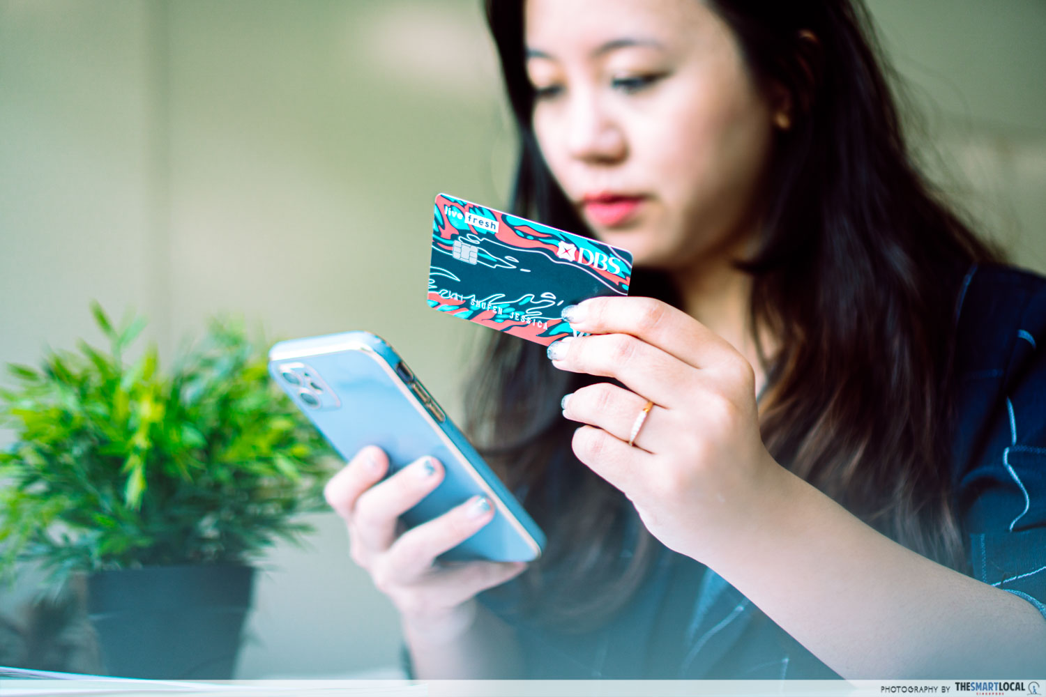girl holding credit card